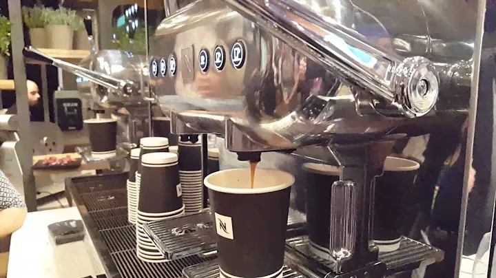 Nespresso Aguila Machine Making Cappuccino