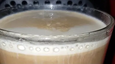 Nespresso Volluto decaffeinato flowing to a soya milk glass
